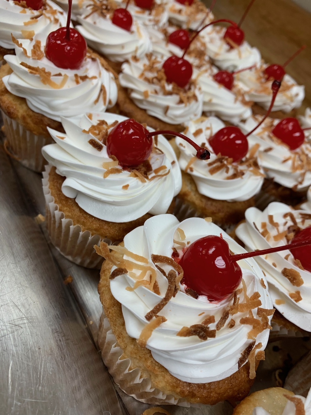 Cherry coconut cupcakes with floral decorations